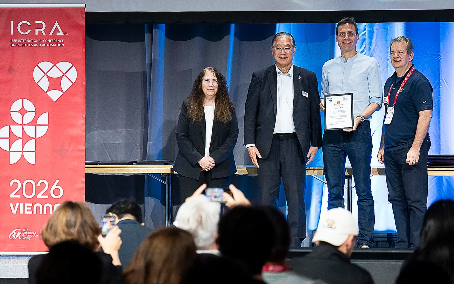 From left to right: Nancy Amato, IEEE RAS president; Takayuki Ito, IFR president; Markus Hehn, Verity AG; Jim Ostrowski, IEEE RAS VP for Industrial Activities